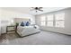 Serene main bedroom with plush carpeting, ample natural light, and a tufted headboard at 1050 Windsor Estates Ct, Westfield, IN 46074