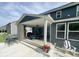 Outdoor patio with covered lounge area, fireplace, tv, and ample seating for outdoor entertainment at 1050 Windsor Estates Ct, Westfield, IN 46074