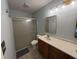 Well-lit bathroom features a glass shower and a modern vanity with neutral countertop at 11163 Autumn Harvest Dr, Fishers, IN 46038