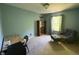 Inviting bedroom offers natural light, complemented by a cozy chair and bookshelf at 11163 Autumn Harvest Dr, Fishers, IN 46038