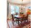 Bright dining room with a chandelier, large window, and ornate rug at 11163 Autumn Harvest Dr, Fishers, IN 46038