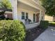 Cozy front porch with seating and colorful flowerbeds enhancing the home's curb appeal at 11163 Autumn Harvest Dr, Fishers, IN 46038