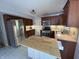 Modern kitchen featuring stainless steel appliances, wooden cabinets, and updated countertops at 11163 Autumn Harvest Dr, Fishers, IN 46038