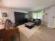 Living room with hardwood floors, stylish decor, and plenty of natural light at 11163 Autumn Harvest Dr, Fishers, IN 46038
