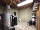 Functional utility room shows water heater, shelving and some supplies at 11163 Autumn Harvest Dr, Fishers, IN 46038