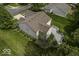 Aerial view of a backyard with a deck, green landscaping, and a lush lawn at 1119 Albemarle Cir, Noblesville, IN 46062
