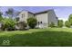 A spacious backyard featuring a well-maintained lawn and a charming white deck at 1119 Albemarle Cir, Noblesville, IN 46062