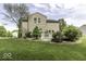 A spacious backyard featuring a well-maintained lawn and a charming white deck at 1119 Albemarle Cir, Noblesville, IN 46062