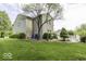 A spacious backyard featuring a well-maintained lawn and a charming white deck at 1119 Albemarle Cir, Noblesville, IN 46062