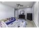 A bedroom with gray walls, carpet, two twin beds, and a dark dresser with a mirror at 1119 Albemarle Cir, Noblesville, IN 46062
