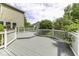 An expansive gray deck with white railings, perfect for outdoor entertaining and relaxation at 1119 Albemarle Cir, Noblesville, IN 46062