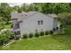 Exterior shot of home featuring landscaped yard, green grass, small bushes and neutral siding at 1119 Albemarle Cir, Noblesville, IN 46062