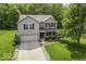 Aerial view of a two-story house with a two-car garage and well-manicured lawn at 1119 Albemarle Cir, Noblesville, IN 46062