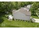 Beautiful home exterior featuring a well-maintained lawn, deck and manicured landscaping at 1119 Albemarle Cir, Noblesville, IN 46062