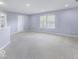 An open loft space features neutral paint, carpet, natural light, and closet at 1119 Albemarle Cir, Noblesville, IN 46062