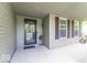 Inviting covered porch featuring dark framed windows and space for decorative plants at 1119 Albemarle Cir, Noblesville, IN 46062