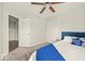 Bedroom features a ceiling fan, carpet, closet and bright natural light at 11199 Boston Way, Fishers, IN 46038