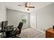 Comfortable bedroom featuring a ceiling fan, closet, and ample natural light from the window at 11199 Boston Way, Fishers, IN 46038