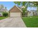 Charming home featuring a brick facade, attached two-car garage, and well-maintained landscaping at 11199 Boston Way, Fishers, IN 46038
