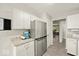 Modern kitchen featuring stainless steel appliances, granite countertops, and ample cabinet space at 11199 Boston Way, Fishers, IN 46038
