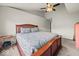 Spacious carpeted main bedroom features a ceiling fan, natural light and ample space for furnishings at 11199 Boston Way, Fishers, IN 46038