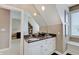 This bathroom features dual sinks with granite counters and a wall of mirrors at 11508 Willow Ridge Dr, Zionsville, IN 46077