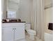 Well-lit bathroom features white vanity, granite countertop, framed mirror and shower/tub combination at 11508 Willow Ridge Dr, Zionsville, IN 46077