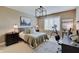 This bedroom features a modern light fixture and a desk with a telescope at 11508 Willow Ridge Dr, Zionsville, IN 46077