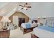 This bedroom features two twin beds with blue bedding and a ceiling fan at 11508 Willow Ridge Dr, Zionsville, IN 46077