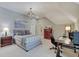 Cozy bedroom features a plush bed, modern chandelier, and a functional workspace at 11508 Willow Ridge Dr, Zionsville, IN 46077