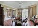 Chic dining room features hardwood floors, chandelier, and natural light for elegant meals and gatherings at 11508 Willow Ridge Dr, Zionsville, IN 46077