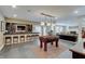 Entertainment room featuring a foosball table, wet bar, and inviting lounge area for leisure and socializing at 11508 Willow Ridge Dr, Zionsville, IN 46077