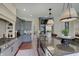 Modern kitchen with granite countertops, designer cabinets, stainless steel appliances, and decorative backsplash at 11508 Willow Ridge Dr, Zionsville, IN 46077