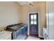 This laundry room features side by side washer and dryer and a door to the outside at 11508 Willow Ridge Dr, Zionsville, IN 46077
