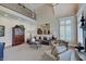 Expansive living room featuring high ceilings, ample seating, hardwood floors, and natural light at 11508 Willow Ridge Dr, Zionsville, IN 46077