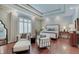 Spacious main bedroom features a tray ceiling, hardwood floors, and lots of natural light at 11508 Willow Ridge Dr, Zionsville, IN 46077