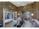 Stylish home office features wood paneled walls, built-in shelving, and a comfortable seating area for productivity at 11508 Willow Ridge Dr, Zionsville, IN 46077