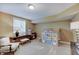 Bright playroom with playhouse, craft area, natural light from the window, and seating at 11508 Willow Ridge Dr, Zionsville, IN 46077