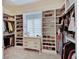 This walk-in closet offers custom shelving and space for clothes and shoes at 11508 Willow Ridge Dr, Zionsville, IN 46077