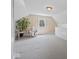 Cozy finished attic with a sitting area, natural light, and sloped ceilings at 116 E Railroad St, Fountaintown, IN 46130
