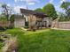 Spacious backyard featuring a charming gazebo and well-maintained lawn at 116 E Railroad St, Fountaintown, IN 46130