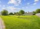 Expansive backyard with lush greenery and a utility building, offering plenty of space and privacy at 116 E Railroad St, Fountaintown, IN 46130