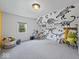 Playful bedroom showcases custom dinosaur wall art at 116 E Railroad St, Fountaintown, IN 46130