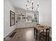Bright dining room features built-in shelving and vinyl floors at 116 E Railroad St, Fountaintown, IN 46130