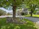 View of the house and the driveway with lawn decor and a garage behind the main house at 116 E Railroad St, Fountaintown, IN 46130