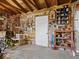 Rustic garage interior with exposed wood beams, vintage decor, and organized storage solutions at 116 E Railroad St, Fountaintown, IN 46130
