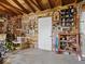 Rustic garage interior with exposed wood beams, vintage decor, and organized storage solutions at 116 E Railroad St, Fountaintown, IN 46130