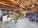 Spacious garage featuring exposed wood beams, ample storage, and room for projects and vehicles at 116 E Railroad St, Fountaintown, IN 46130