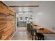 Stylish kitchen boasts blue cabinets, plank wall, and open dining at 116 E Railroad St, Fountaintown, IN 46130