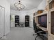 Office features a gaming chair, computer desk, and a chandelier at 116 E Railroad St, Fountaintown, IN 46130